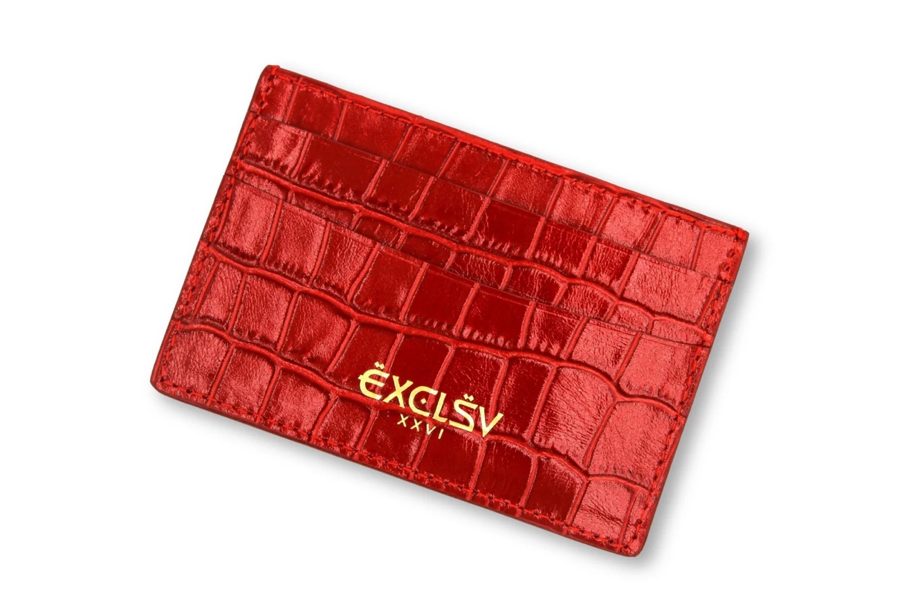 Red crocodile-embossed leather card holder on a white background